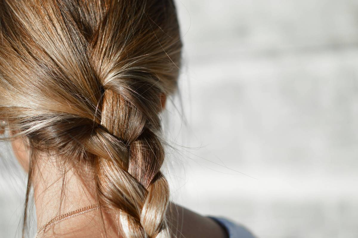 elegant prom headpiece styles on blonde updo under soft lighting