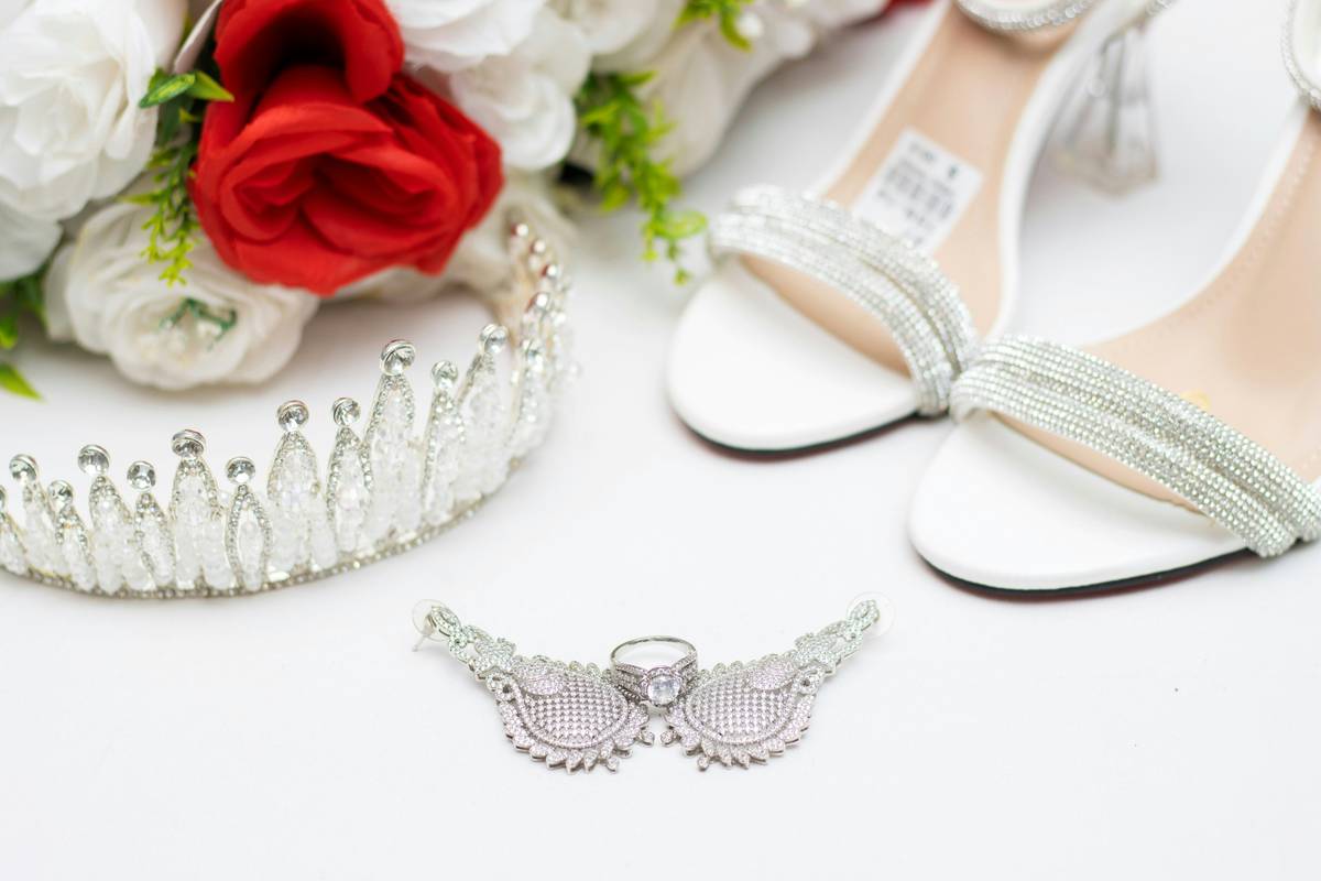 Bride wearing elegant silver wedding headbands with pearl accents and soft updo