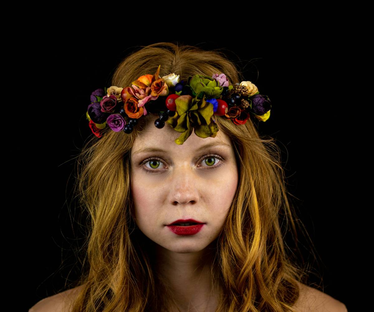 boho headbands woven with floral details on a model with loose waves